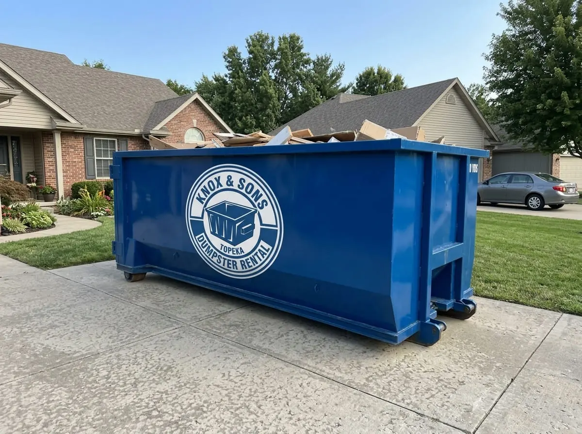 Local dumpster rental in Topeka Knox & Sons Dumpster Rental Topeka roll-off dumpster delivered to a residential driveway in Topeka, KS